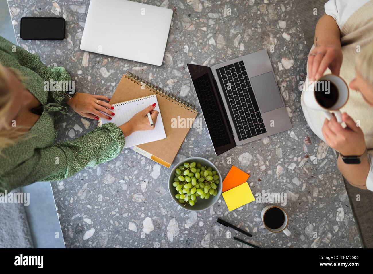 High angle view of women working together Stock Photo