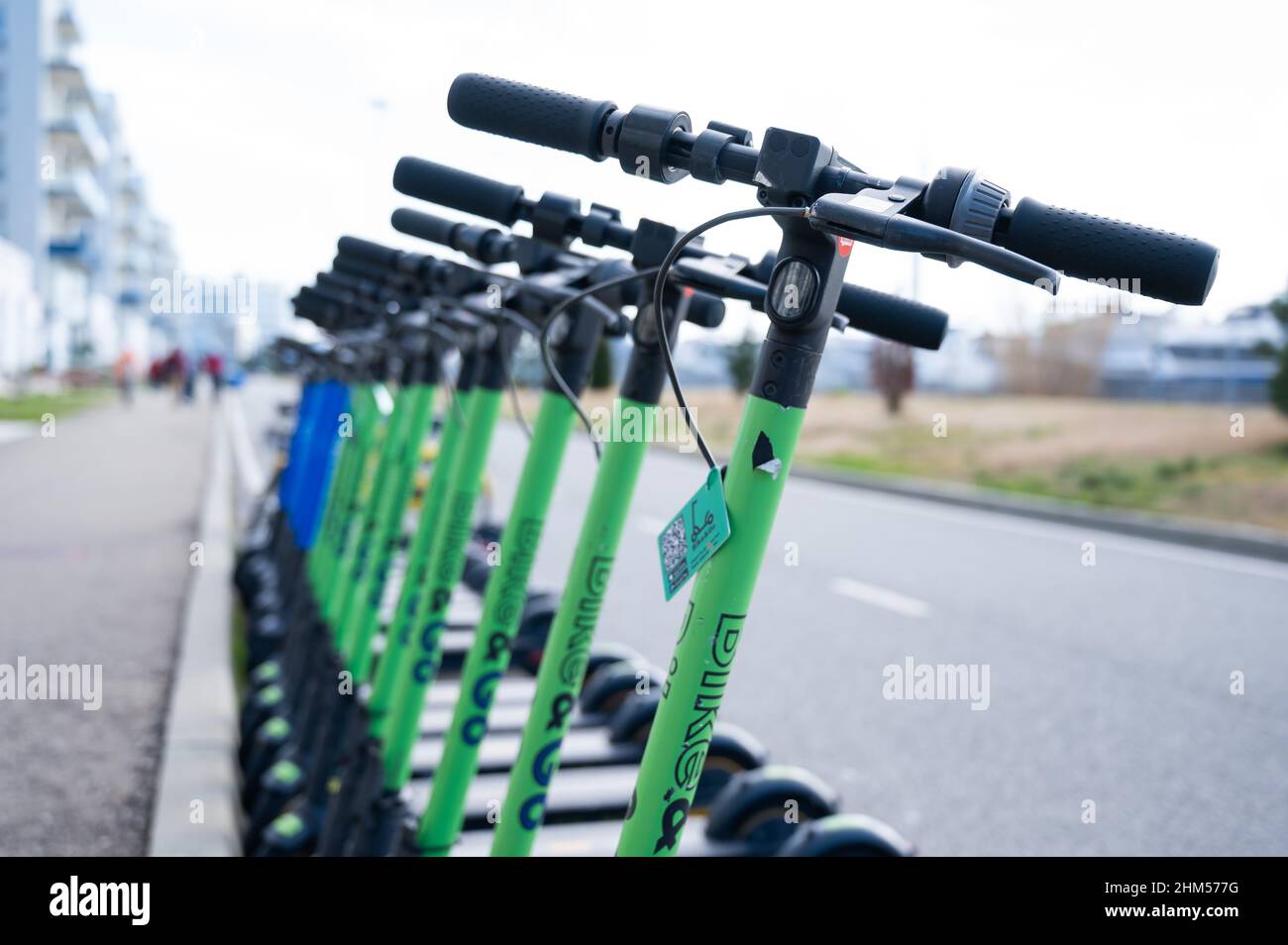 Row of electric scooters for rent outdoors. Stock Photo