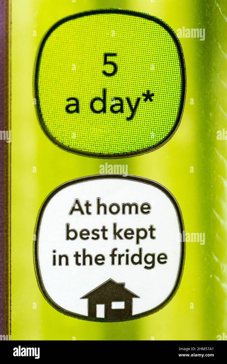 Signs on packet of celery say that it forms part of a consumer's 5 pieces of fruit or veg a day, and that it should be kept in the 'fridge at home. Stock Photo