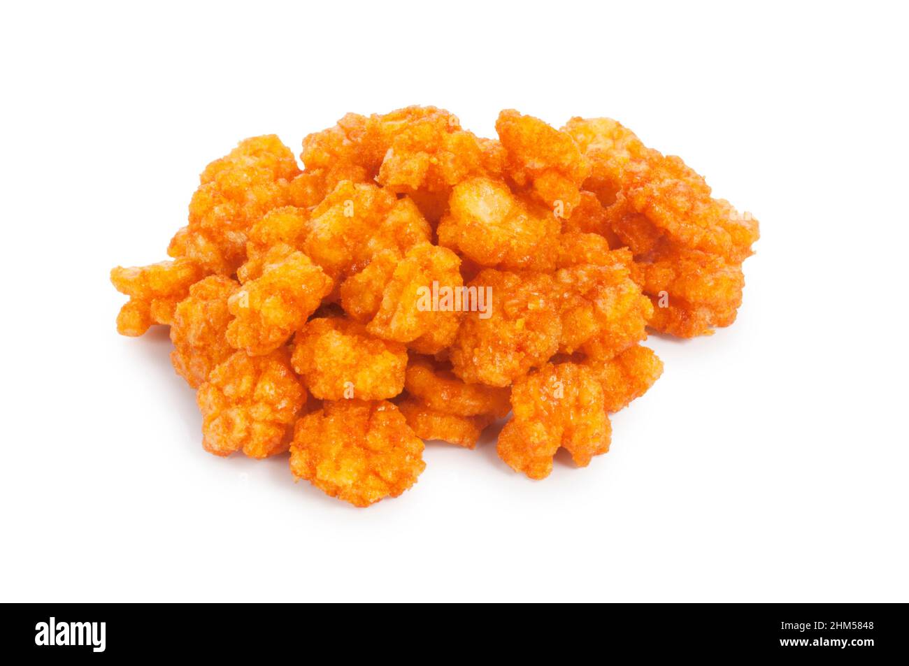Studio shot of chilli flavoured rice crackers cut out against a white background - John Gollop Stock Photo