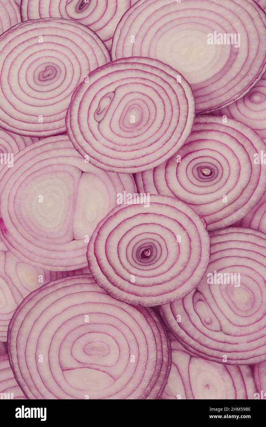 Onion slices as a background. Top view. Stock Photo