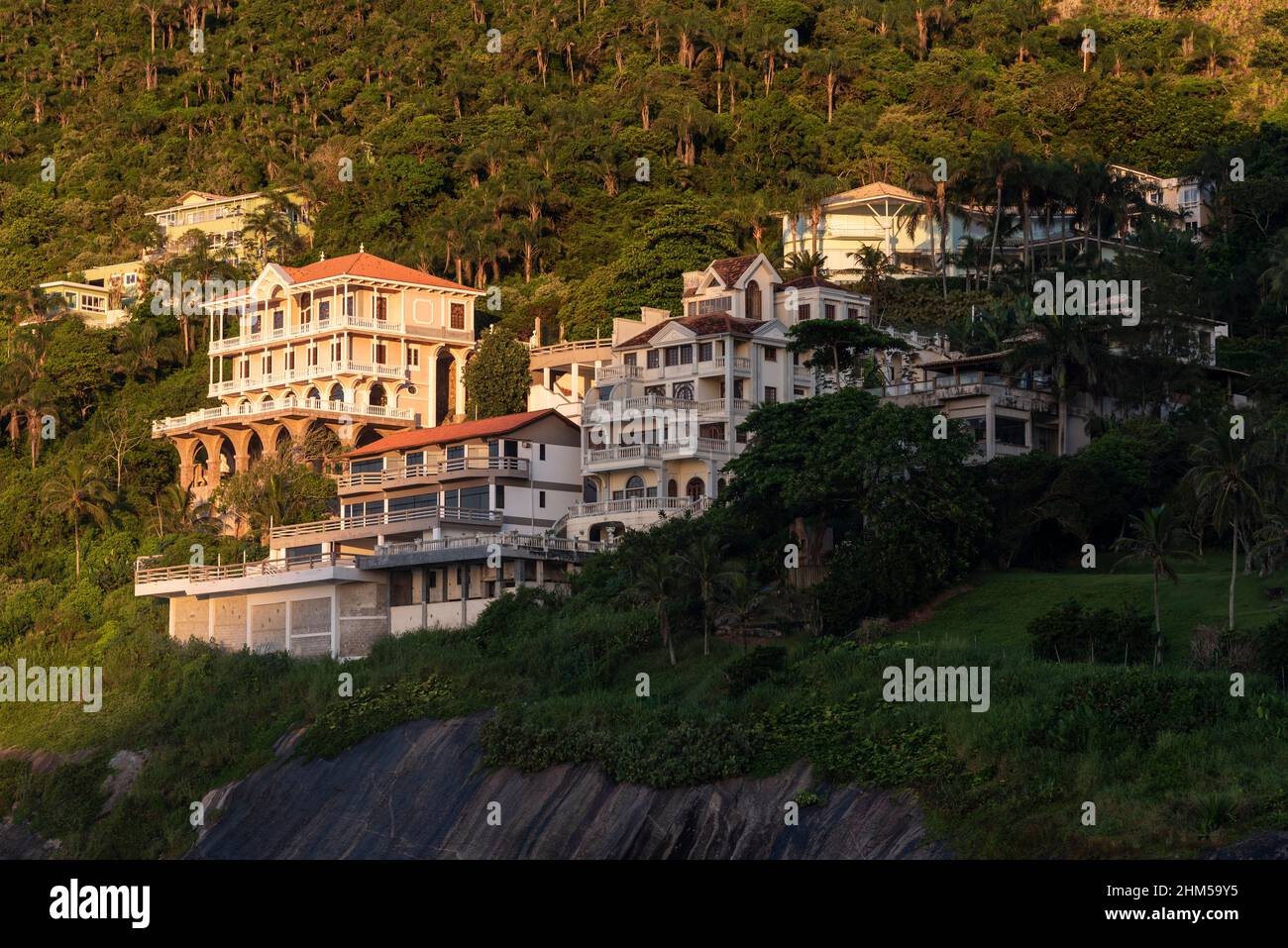 Beautiful view to rich houses on beach rainforest hill side Stock Photo