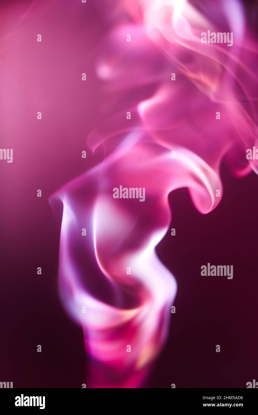 Beautiful red and pink puffs of smoke Stock Photo - Alamy