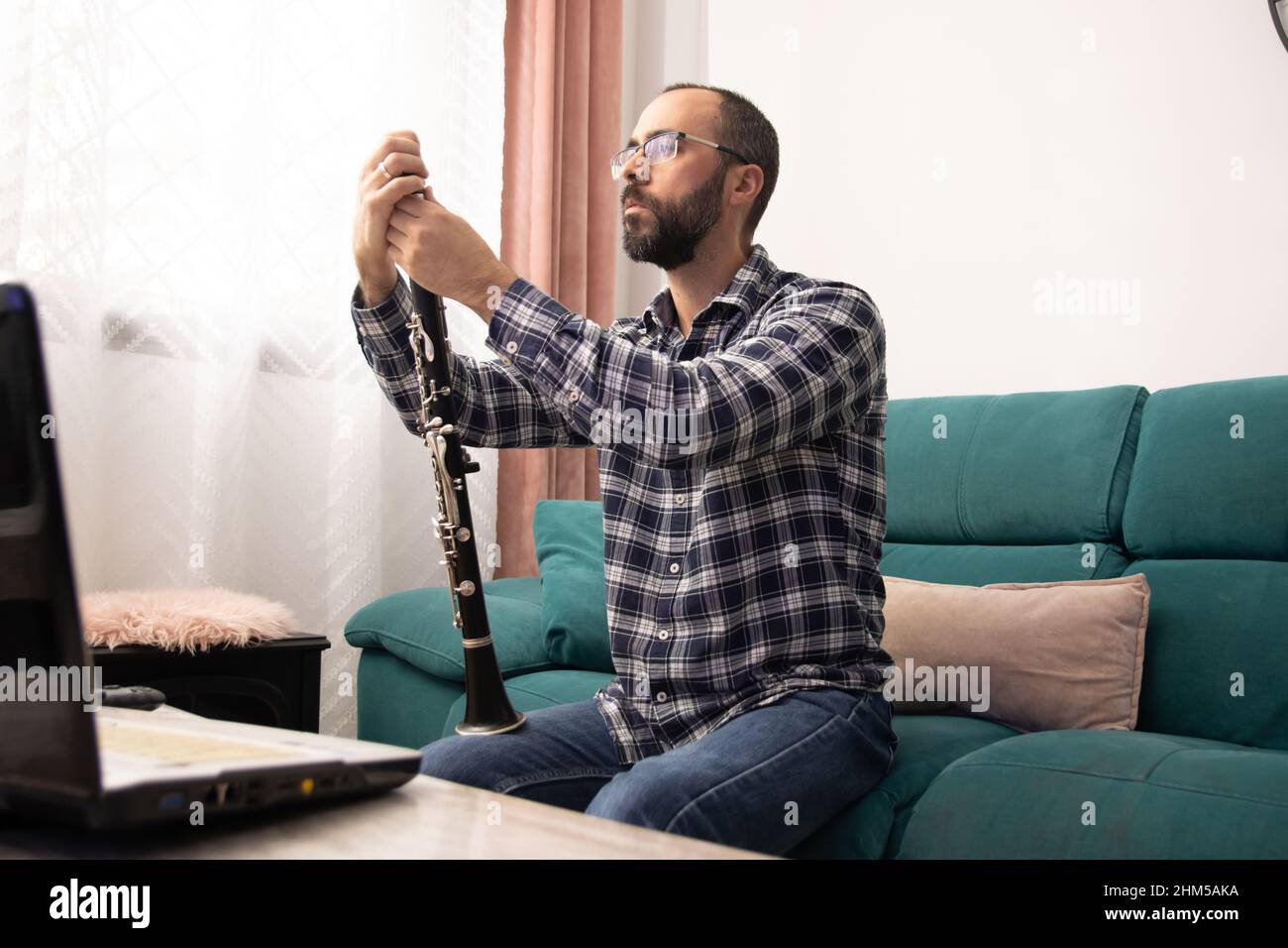 giving online class with the laptop from ho Stock