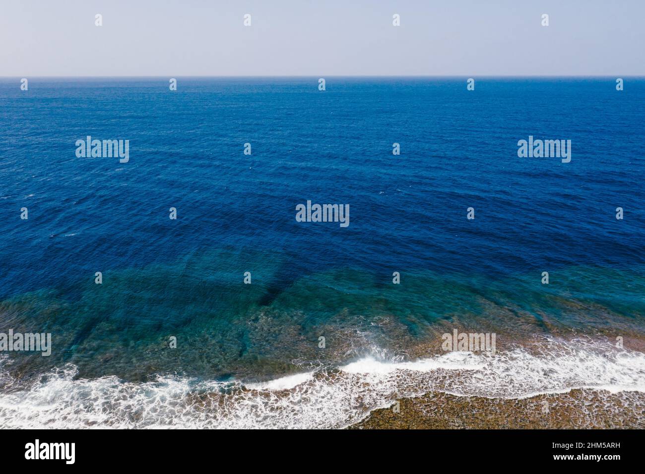 Deep blue ocean landscape with waves and coral reefs Stock Photo