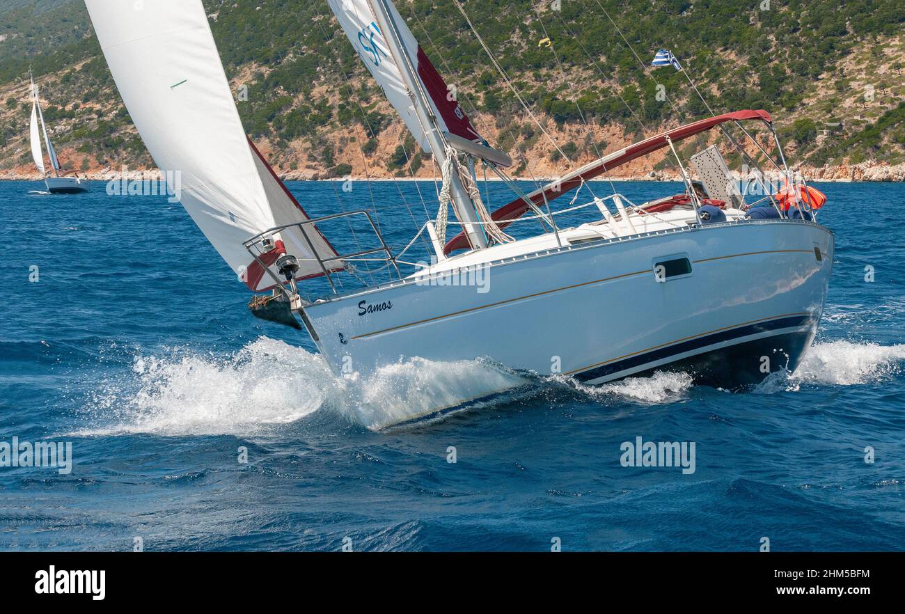 Family on sailing holiday in mid-summer off the Greek island of Alonnisos in the Aegean sea, Greece, Europe Stock Photo
