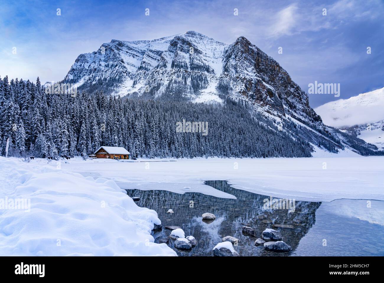 Fairview Mountain and the boathouse in winter at Lake Louise, Banff National Park, Alberta, Canada. Stock Photo