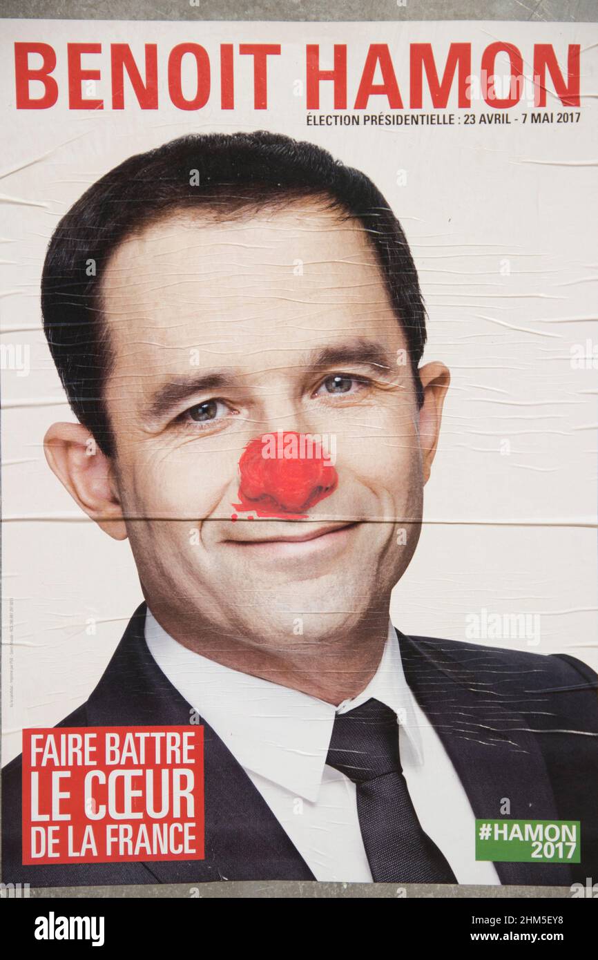 Torn and painted posters of candidates in the presidential election. France. Stock Photo