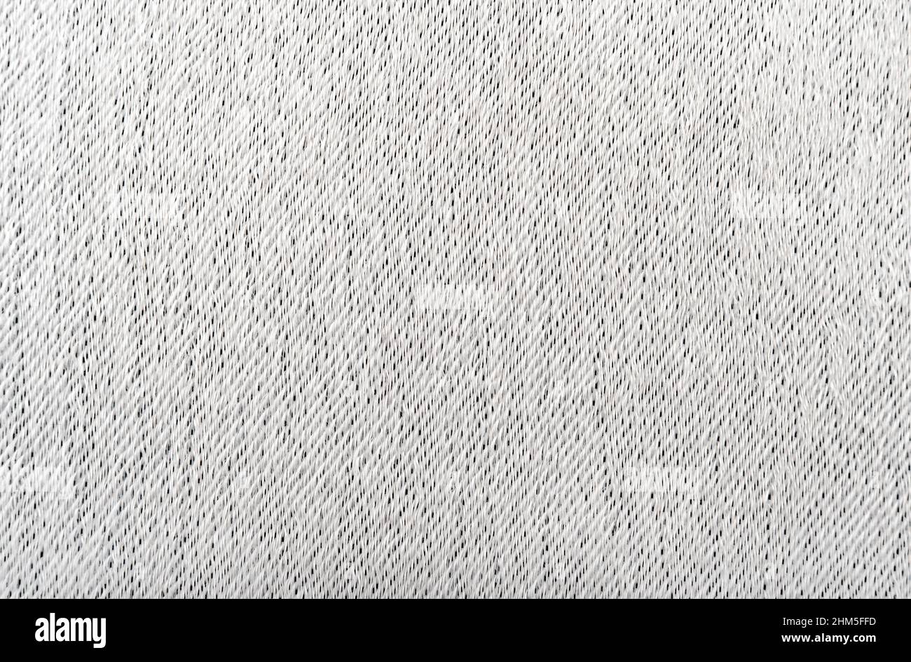 Thick fabric for upholstery in light gray. Texture. Material for a
