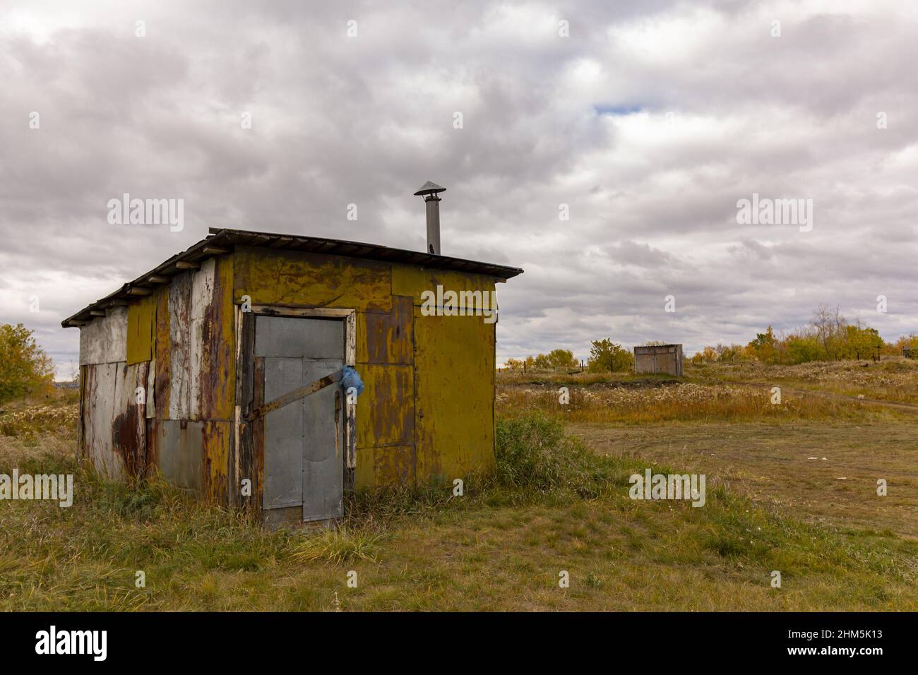 Temporary houses of migrants built from waste on the outskirts of a large city. Stock Photo