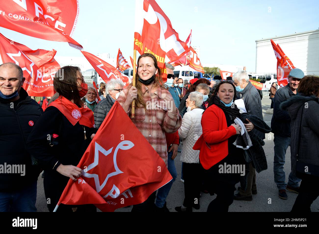 Marseille, France. 06th Feb, 2022. French Communist Party (PCF) supporters hold flags as they arrive at the first campaign meeting of the presidential candidate Fabien Roussel in Marseille.Fabien Roussel, candidate of the French Communist Party (PCF), chose Marseille for his first campaign rally in the French presidential election. (Photo by Gerard Bottino/SOPA Images/Sipa USA) Credit: Sipa USA/Alamy Live News Stock Photo