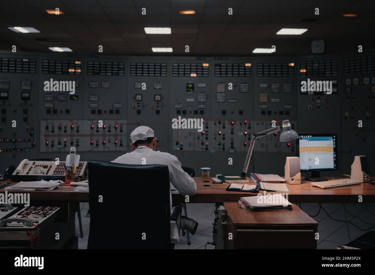 A technician works at the Chernobyl Nuclear Power Plant electricity distribution station. Stock Photo