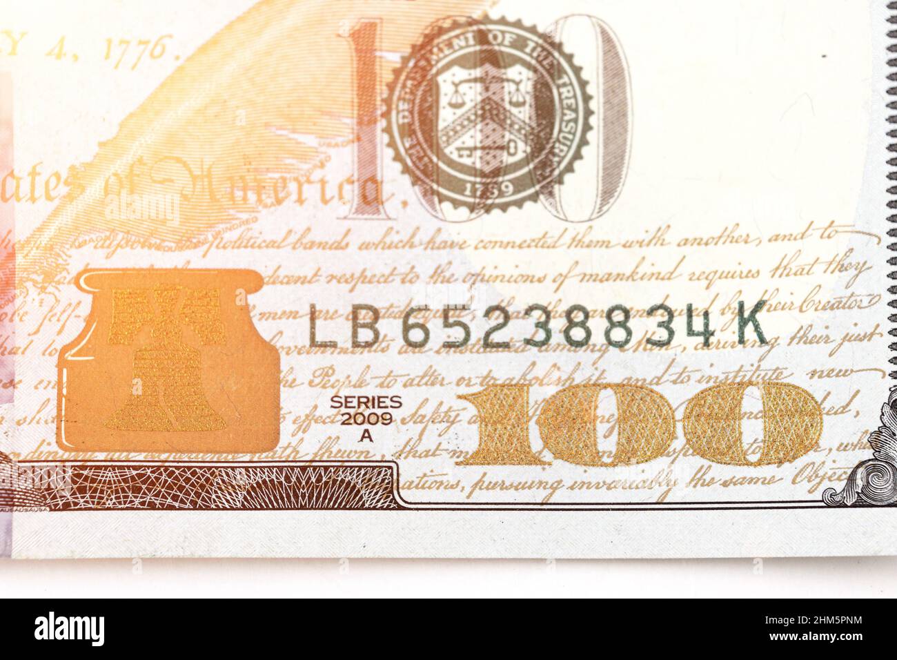 Fragment of the Obverse side of 100 one hundred dollars bill banknote with sunlight. 100. New sample money Stock Photo