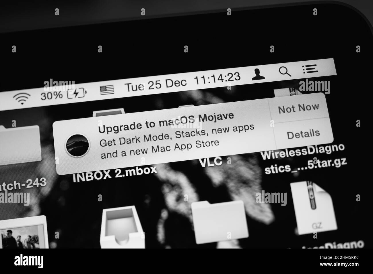 London, United Kingdom - Dec 25, 2018: Black and white image close-up view of Upgrade to MacOs Mojave signage on the Apple Computers MacBook Pro laptop Stock Photo