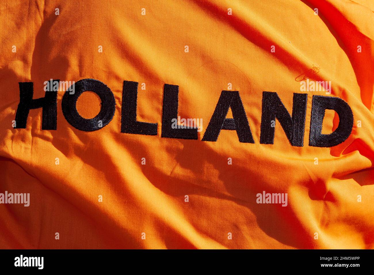 Word Holland in black on orange background Stock Photo