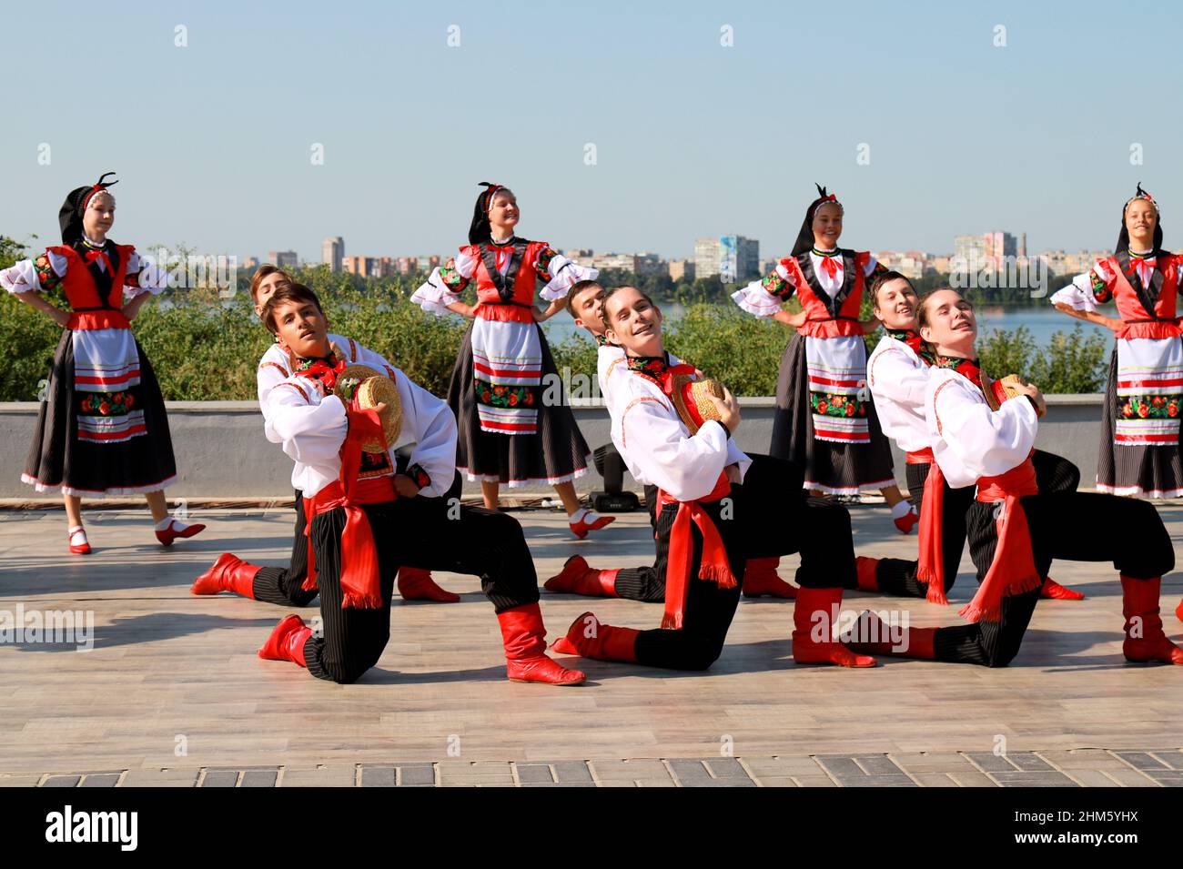 Girls and boys dancing national ukrainian dance in folk costumes hi-res ...