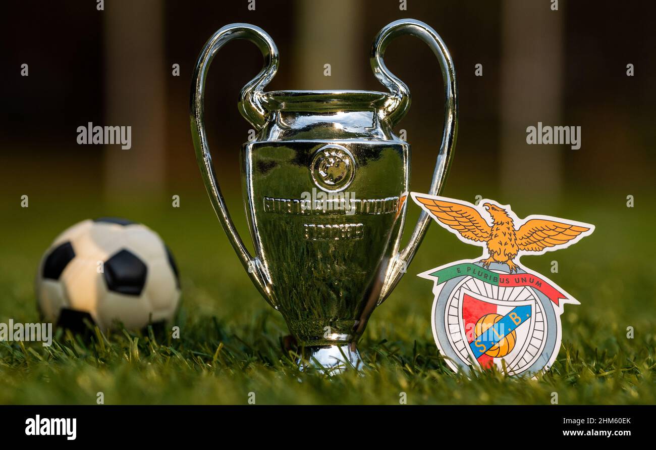 August 27, 2021, Lisbon, Portugal. S.L. football club emblem Benfica and the UEFA Champions League Cup on the green turf of the stadium. Stock Photo