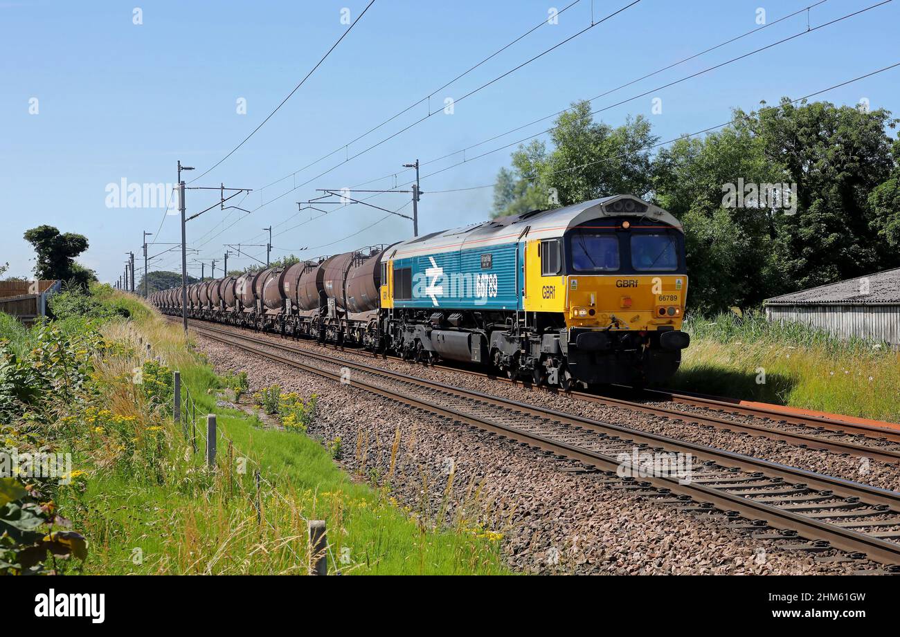 66789 heads past Bolton le Sands on 14.7.21 with 6S94 Wembley to Irvine china clays. Stock Photo