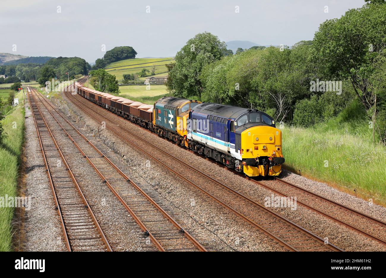 37425 & 37402 pass Settle Jc on 15.6.21 with 6K05 Carlisle to Crewe engineers. Stock Photo