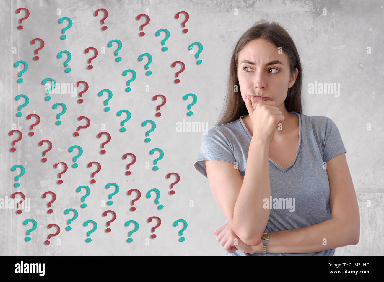 Portrait of wonderful young woman with question marks Stock Photo - Alamy