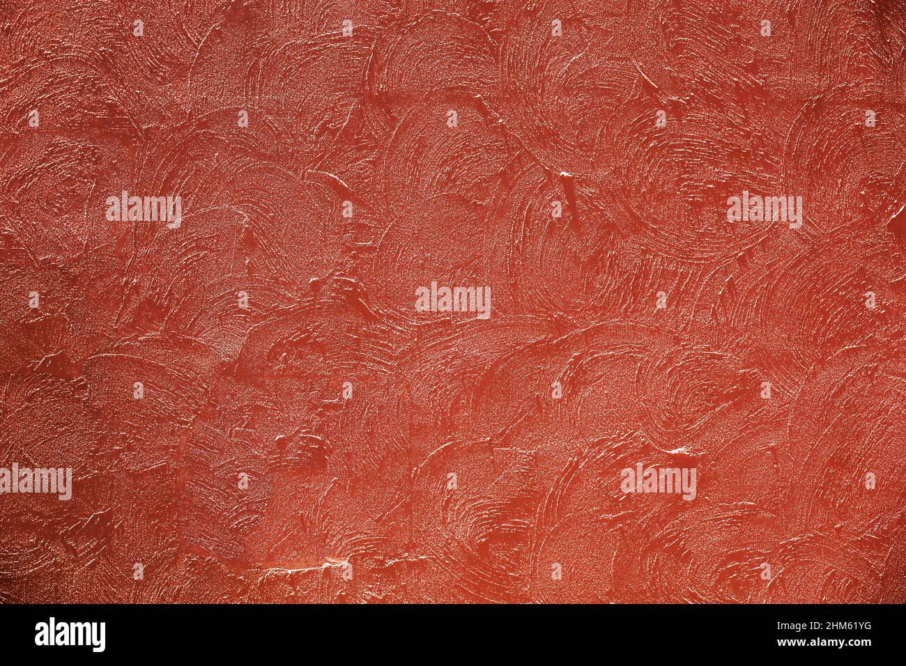 Photograph for background material taken from the front of a terracotta color plaster wall Stock Photo