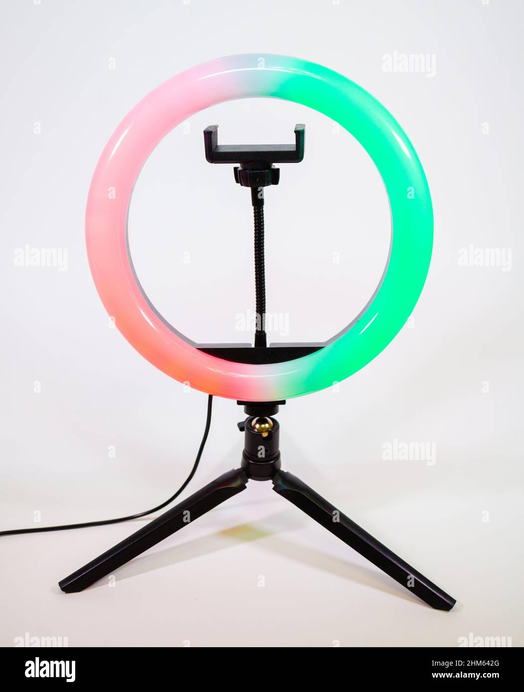 Ring lamp on a small tripod. Red and green lights. Stock Photo