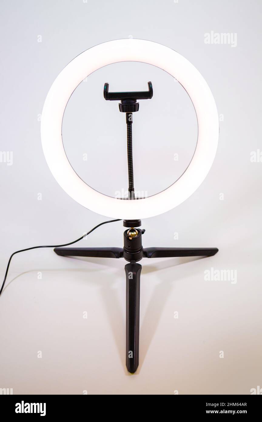 Ring lamp on a small tripod. White light. Stock Photo