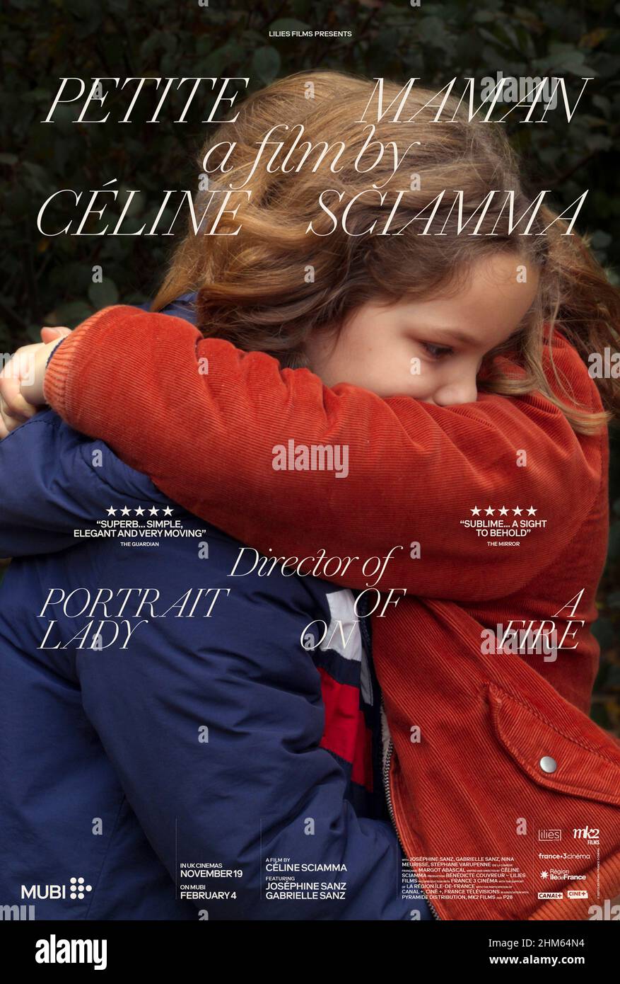 Petite Maman (2021) directed by Céline Sciamma and starring Joséphine Sanz, Gabrielle Sanz and Nina Meurisse. Whilst exploring her recently deceased grandmother's house and surrounding woods Nelly meets a girl the same age as her building a den. Stock Photo