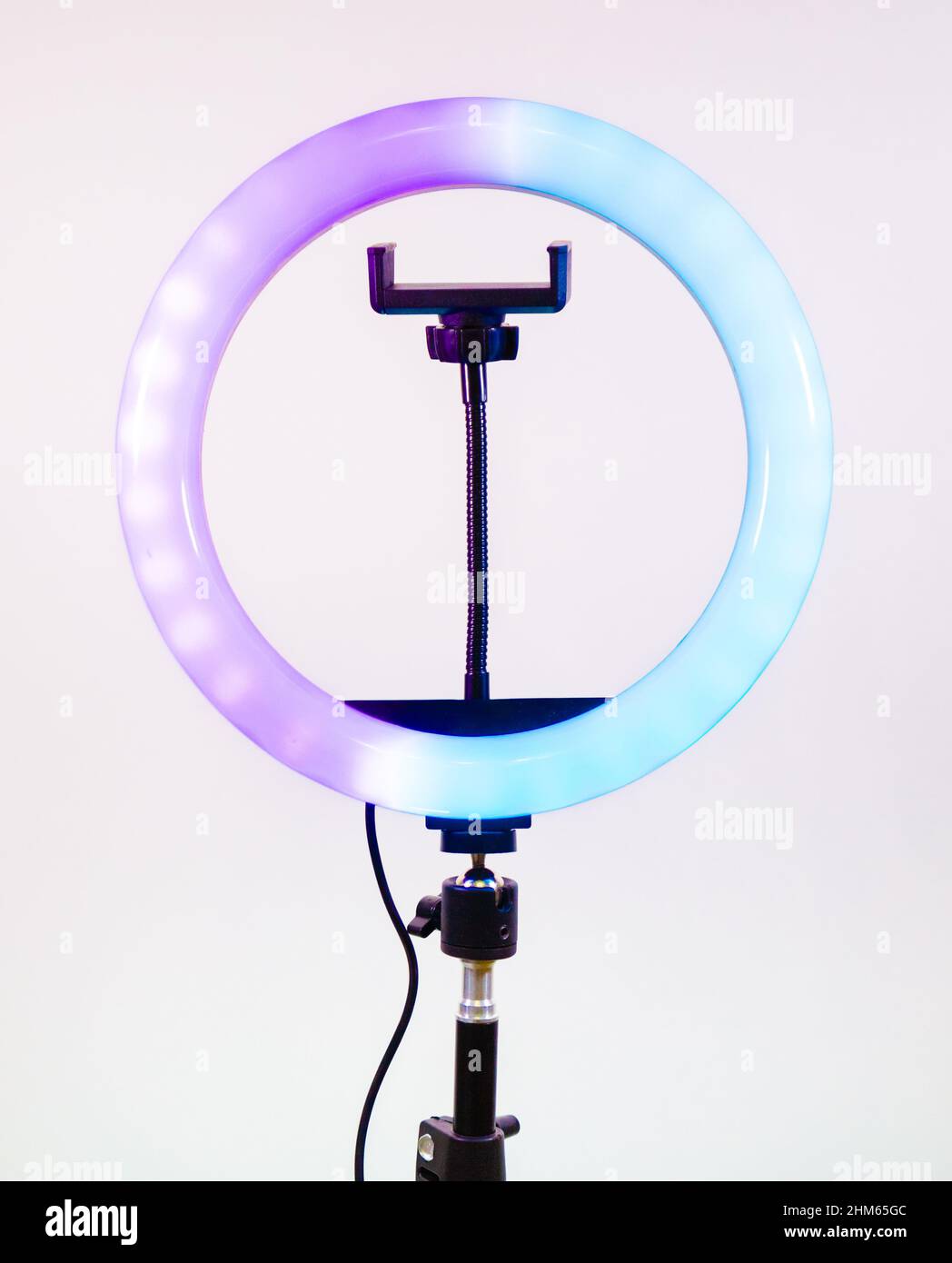 Ring lamp shines in two colors. Blue and purple. Stock Photo