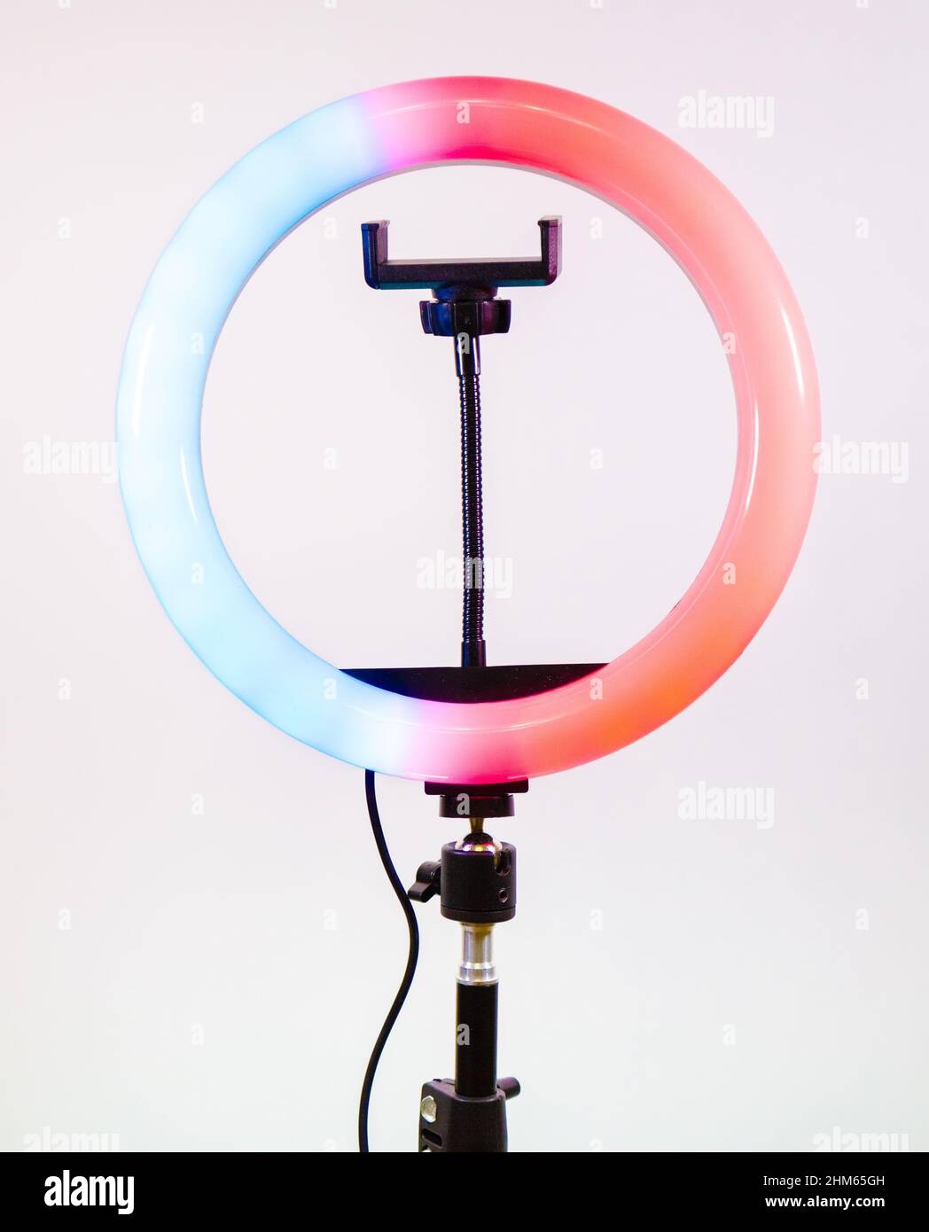 Ring lamp shines in two colors. Blue and red. Stock Photo