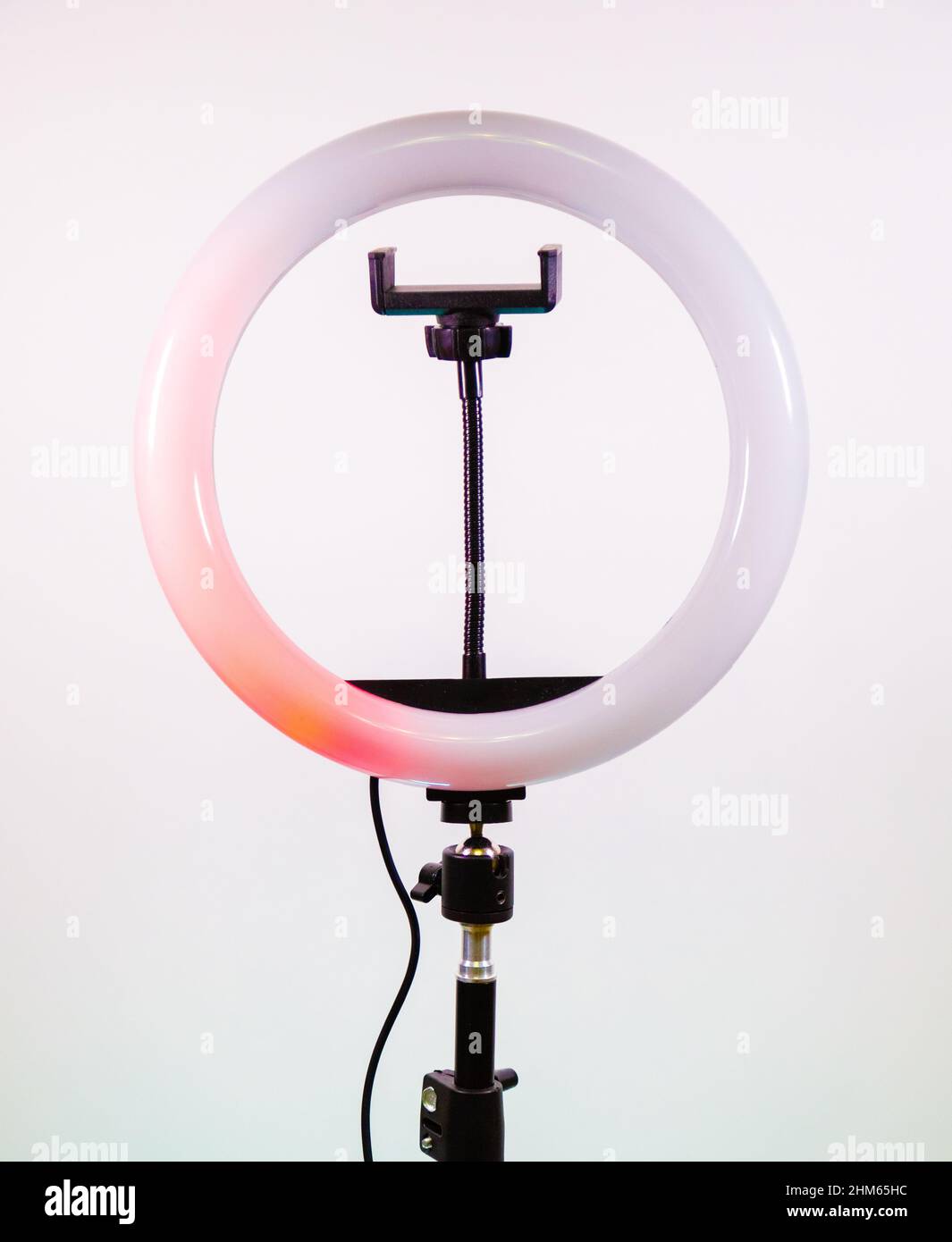 The red light moves in a circle. Ring lamp. Stock Photo