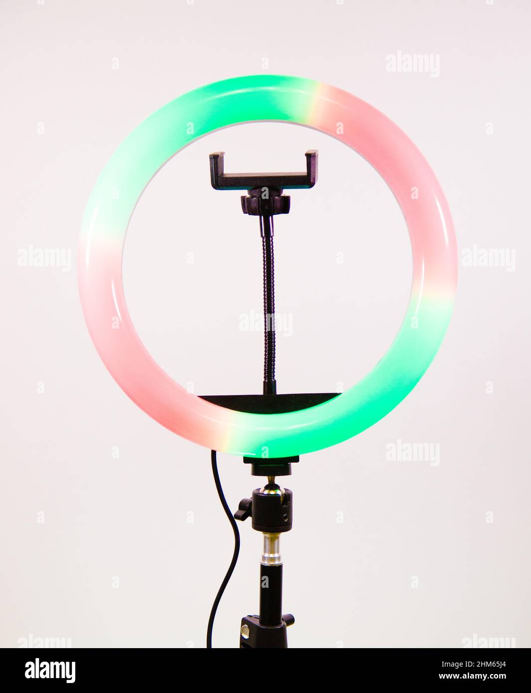 Ring lamp shines in two colors. Red and green. Stock Photo