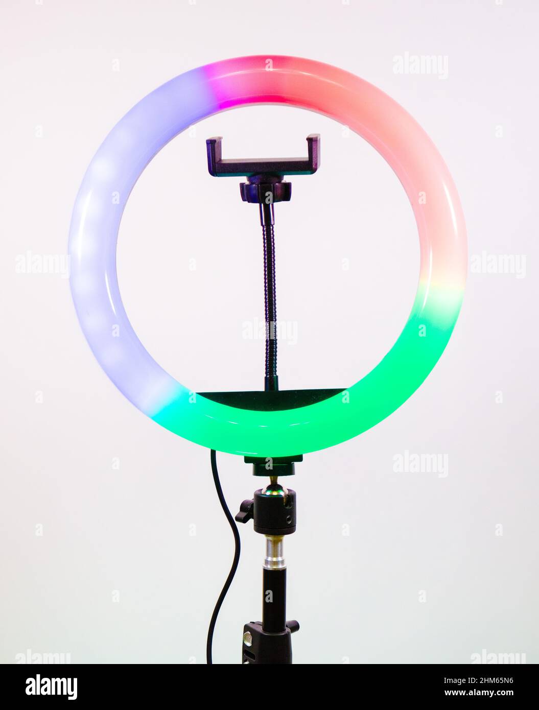 Play of colours in the ring lamp. The magic of light. Stock Photo