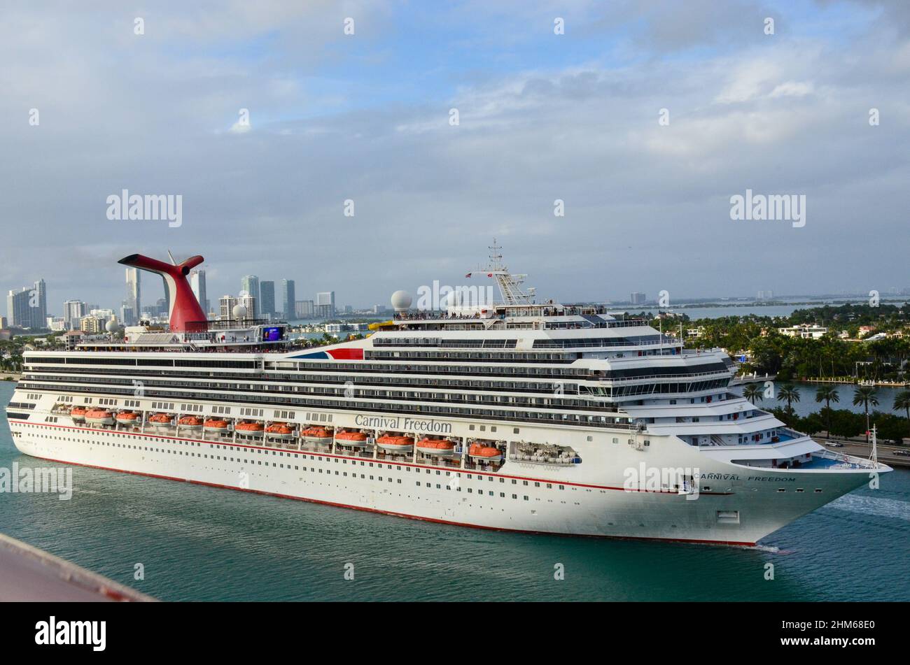 Carnival Freedom cruise ship sailing out to sea at Port of Miami. Cruise Port Terminal in Miami Beach, Florida, USA. January 9, 2022. Stock Photo