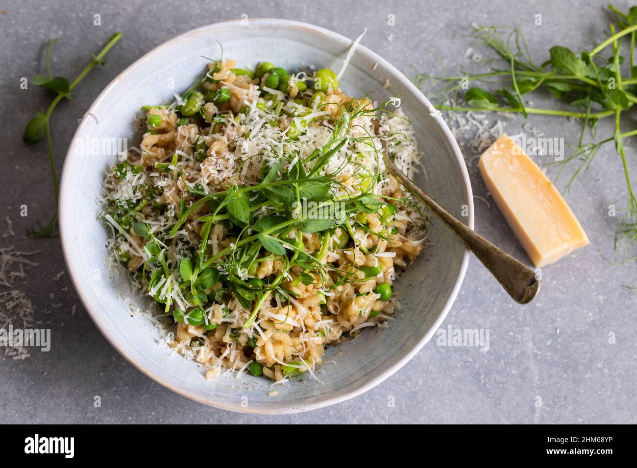 Risotto with broad beans, green pea and pea shoots Stock Photo Alamy