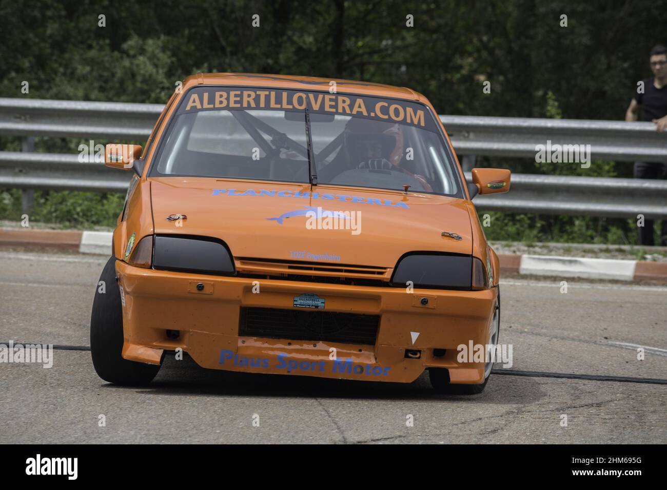 Orange Citroen Ax racing on the asphalt rally at full speed Stock Photo