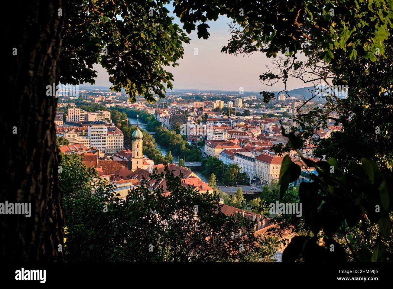 City view over Graz with the river Mur from the Schlossberg at sunset Stock Photo