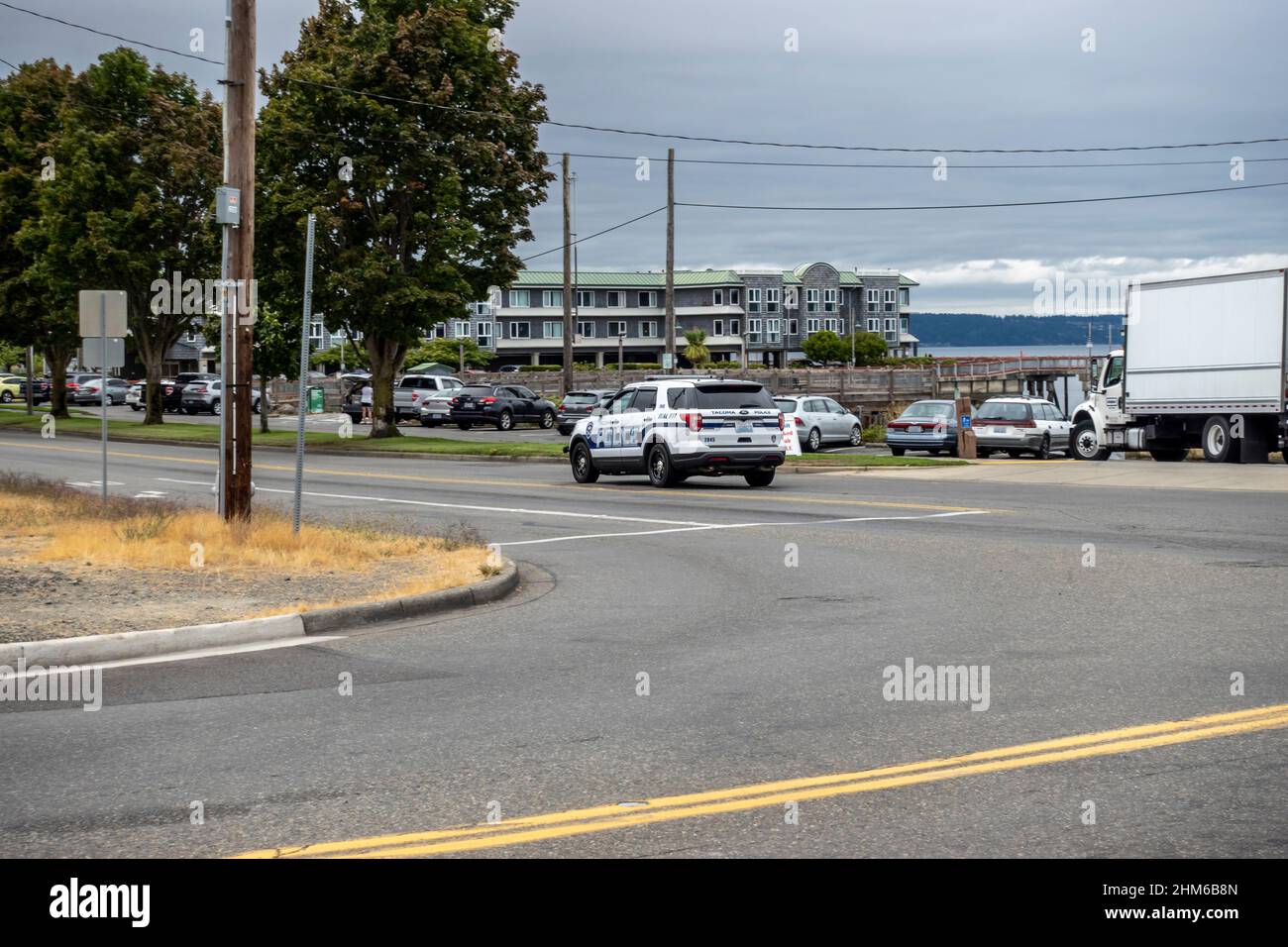 Tacoma, WA USA - circa August 2021: Street view of a Tacoma police SUV making its patrols in the Old Town area on an overcast day. Stock Photo