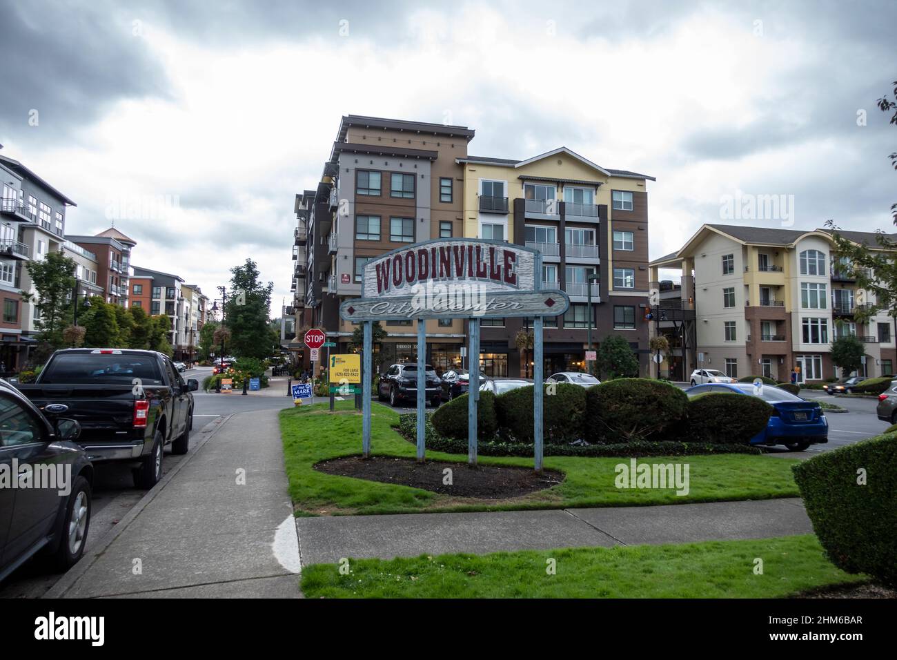 Woodinville, WA USA - circa September 2021: Street view of the Woodinville city center sign outside of a major shopping area on a cloudy, overcast day Stock Photo