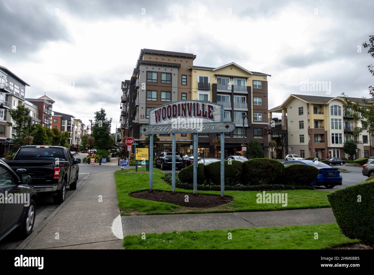 Woodinville, WA USA - circa September 2021: Street view of the Woodinville city center sign outside of a major shopping area on a cloudy, overcast day Stock Photo