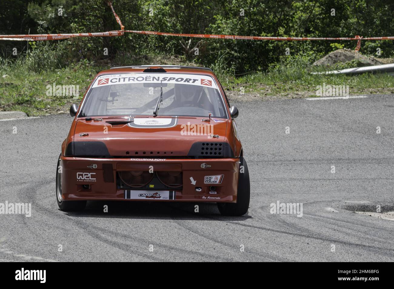 Red Citroen Ax racing on the asphalt rally at full speed Stock Photo