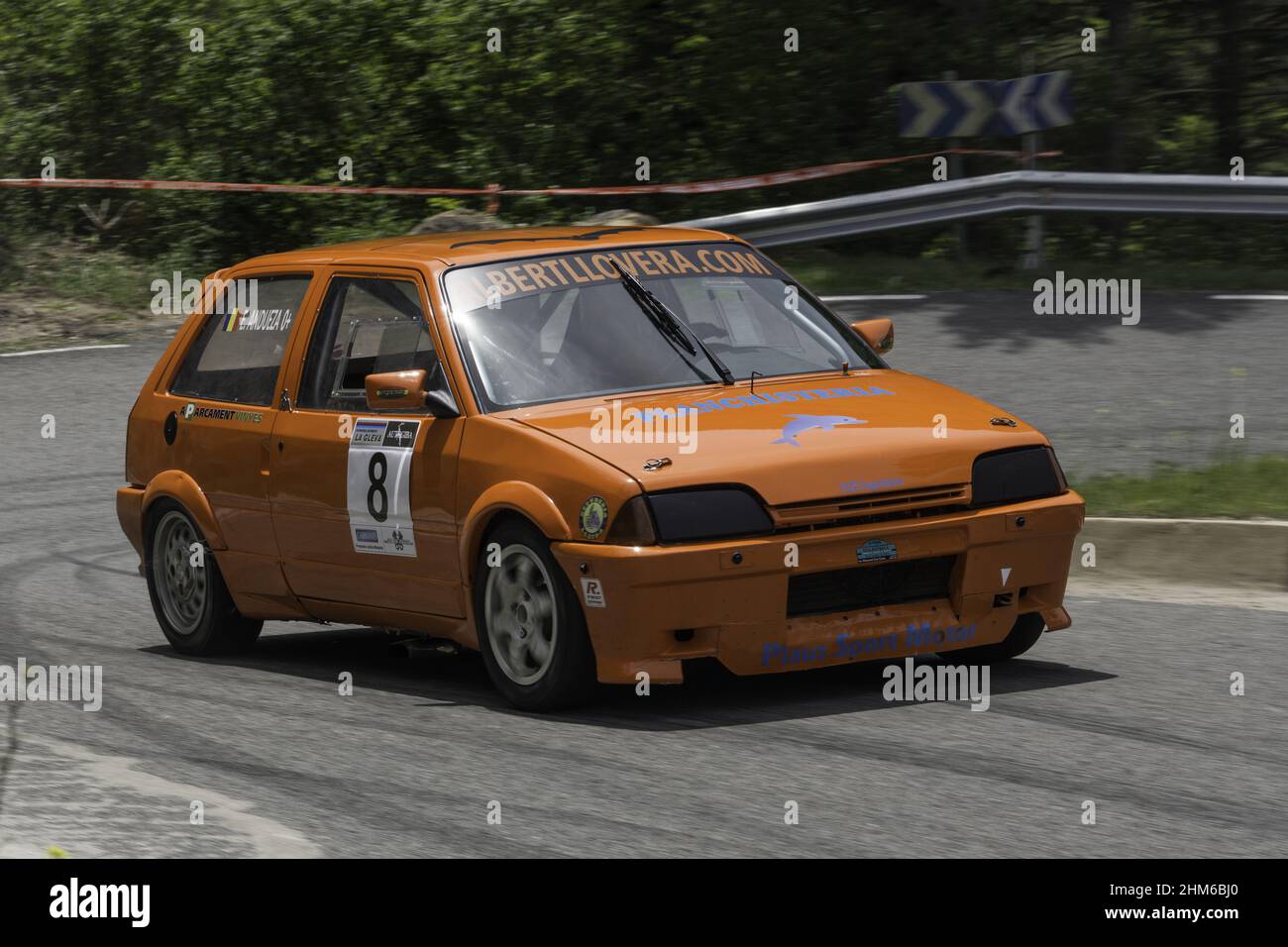 Orange Citroen Ax racing on the asphalt rally at full speed Stock Photo