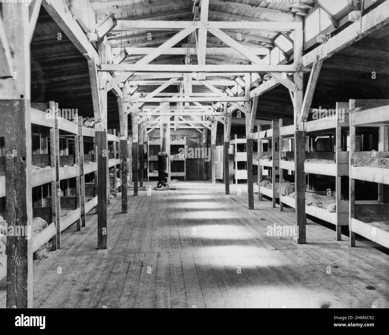 The interior of a barracks in the Flossenbuerg concentration camp that was intended to house 1500 prisoners. / A barrack at Flossenbürg concentration camp, photographed after liberation on May 5th 1945 Stock Photo