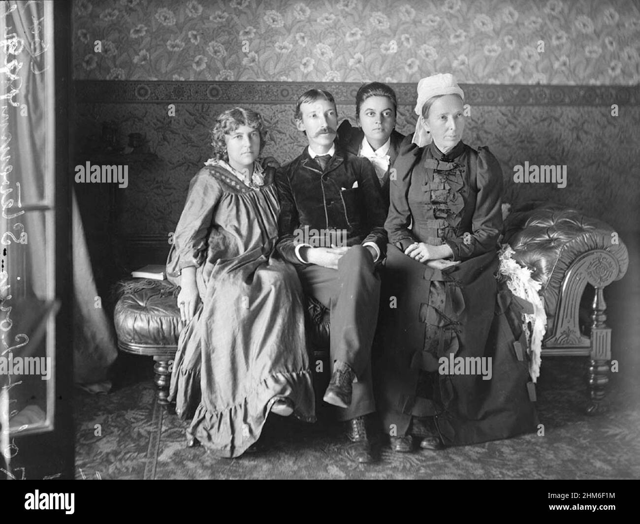 A portrait of the Scottish writer Robert Louis Stevenson, author of Treasure Island and The Black Arrow,  with his family in 1893. He is with his wife Fanny, Stevenson, his stepdaughter Isobel, and his mother Margaret Balfour. Stock Photo