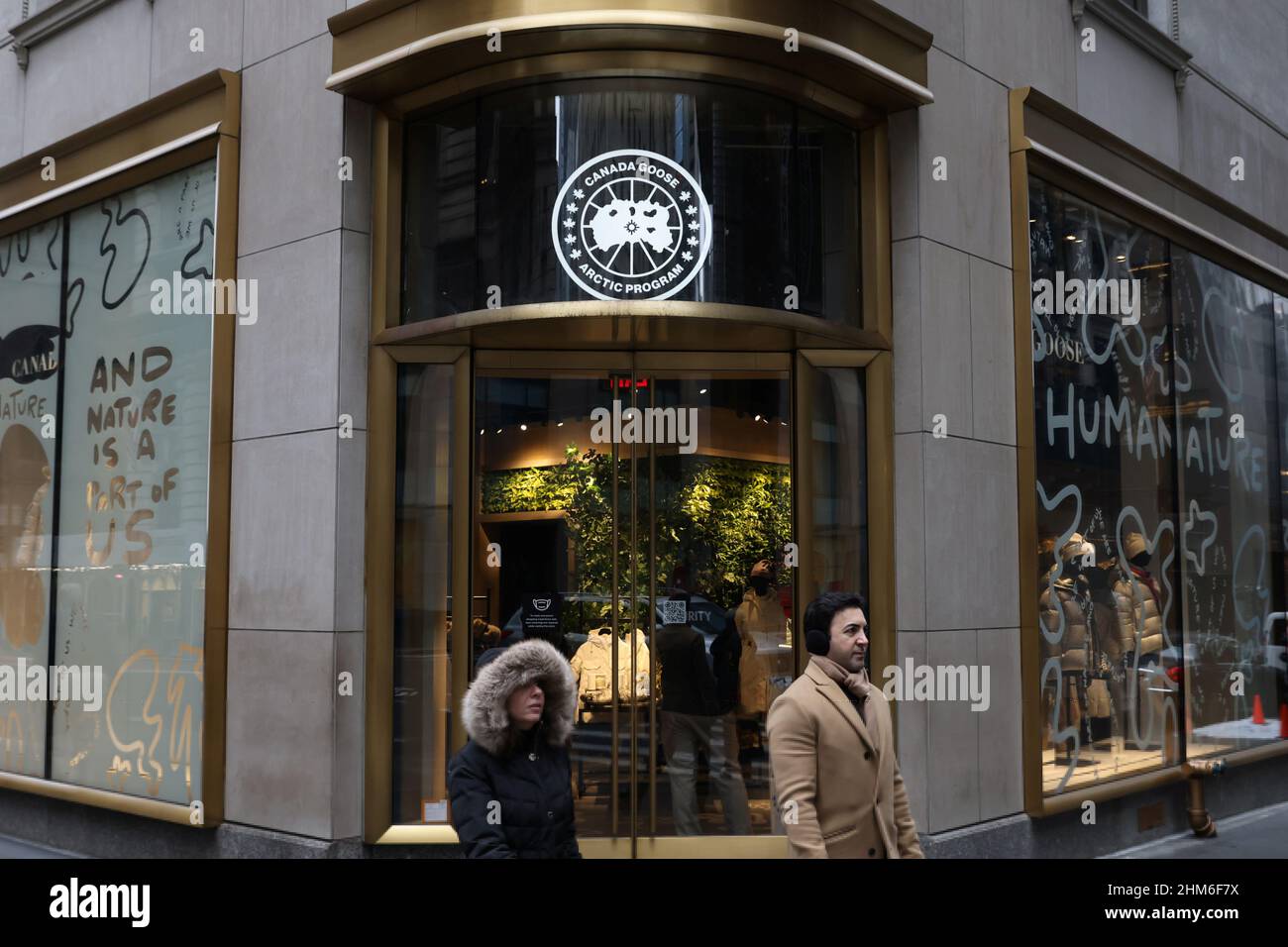 People walk by a Canada Goose store in Manhattan, New York City, U.S.,  February 7, 2022. REUTERS/Andrew Kelly Stock Photo - Alamy