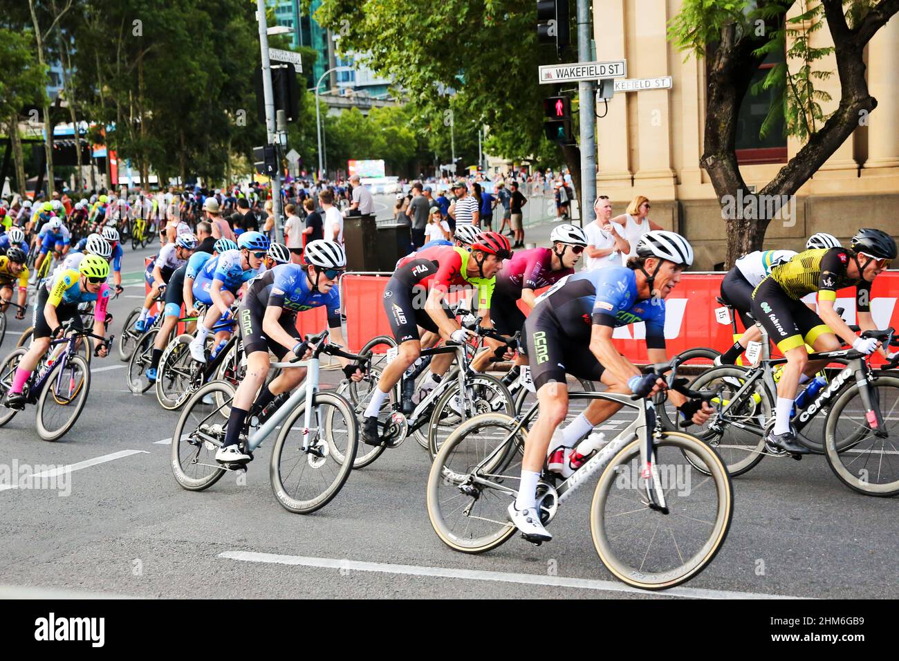 Riders in the Men's Night Rider's Criterium negotiation the streets of Adelaide for the 2022 Festival of Cycling in Australia Stock Photo