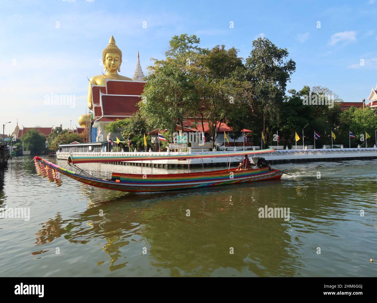 Giant golden Buddha with long tail boat, Wat Paknam Temple ,Phasi Charoen, Bangkok, Thailand Stock Photo