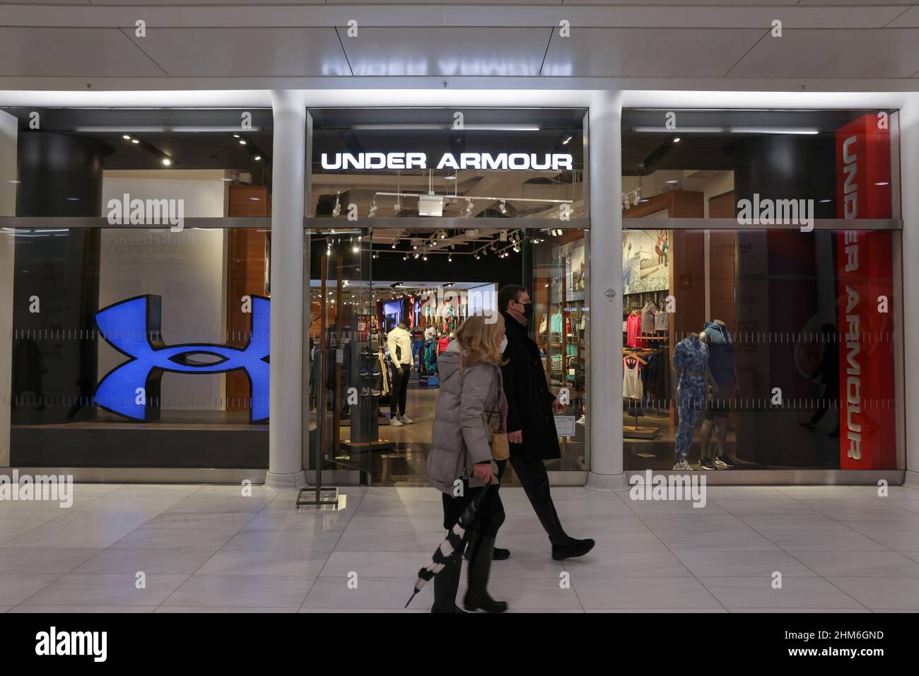 People walk by an Under Armour store in Manhattan, New York City, U.S.,  February 7, 2022. REUTERS/Andrew Kelly Stock Photo - Alamy