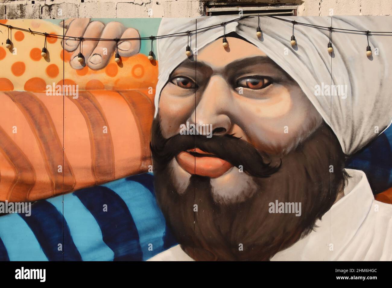 Mural of a  Sikh textile trader at Ong Ang Walking Street by Klong Ong Ang, Chinatown / Phahurat, Bangkok, Thailand, Stock Photo