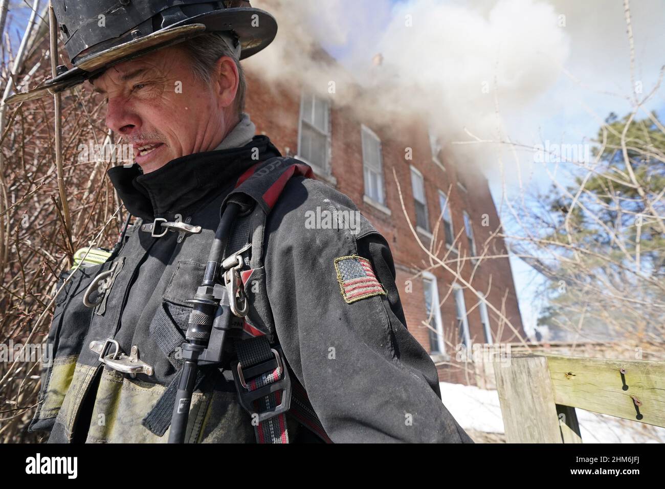 St. Louis, United States. 07th Feb, 2022. St. Louis firefighter Kevin Bussey keeps his head down as he moves away from a vacant building during a 1 alarm fire in St. Louis on Monday, February 7, 2022. Photo by Bill Greenblatt/UPI Credit: UPI/Alamy Live News Stock Photo